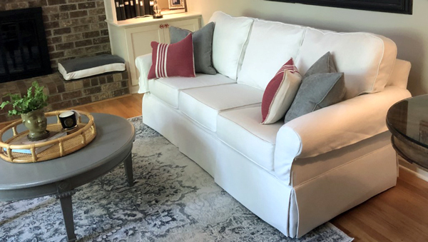 Custom cream-colored couch slipcover